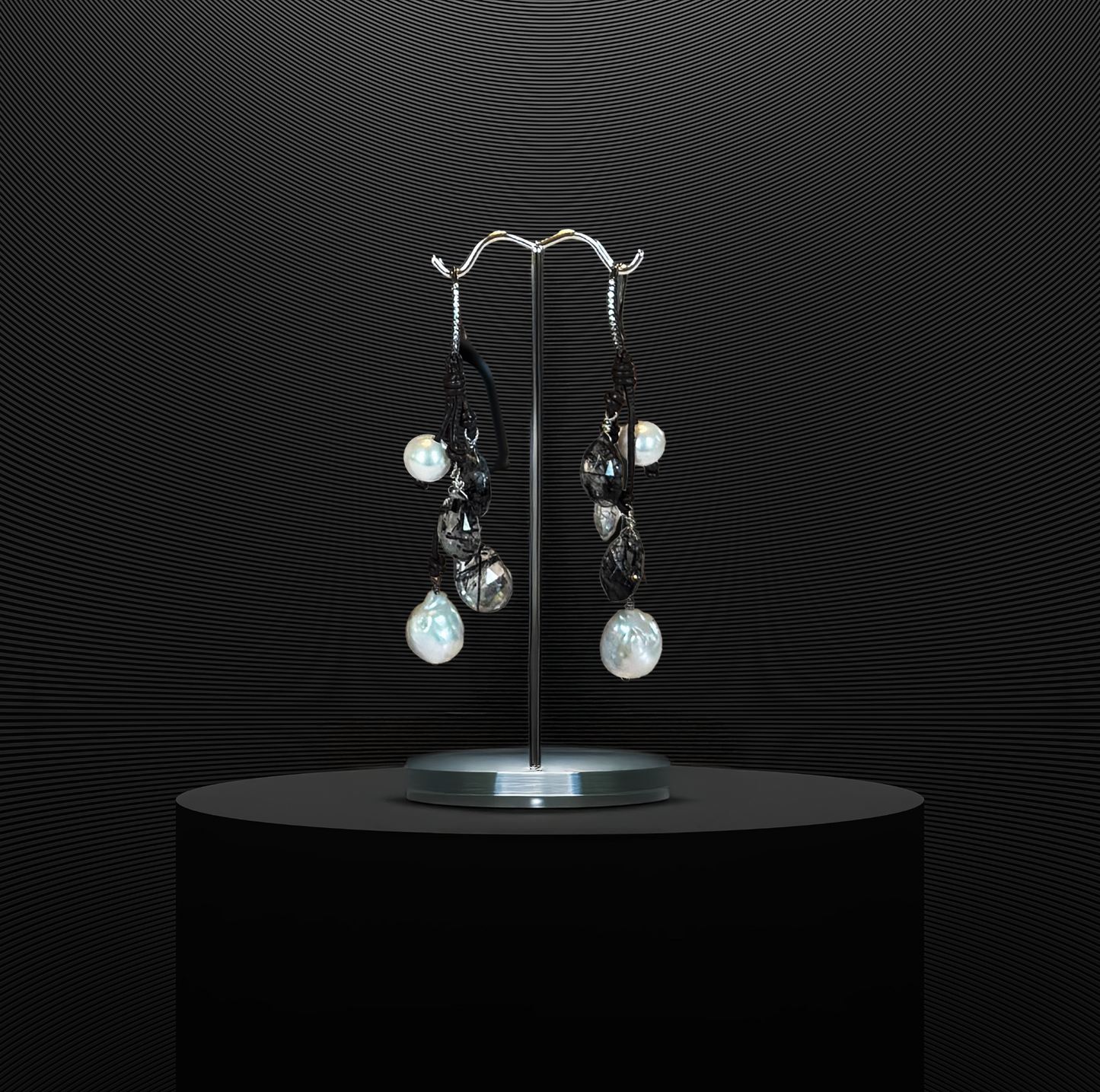 Freshwater pearl earrings with quartz drops on Greek leather, blending natural materials with a touch of elegance.