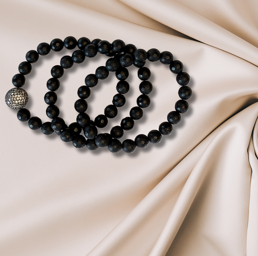 Three hematite bracelets with CZ accents, boasting a sleek, lustrous finish.